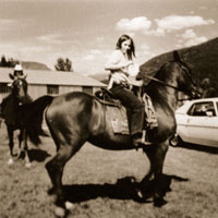 Young Nicola Harwood on horseback